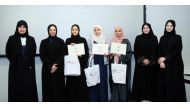 Minister of Education and Higher Education H E Buthaina bint Ali Al Jabr Al Nuaimi (second left); QU Vice-President for Research and Graduate Studies, Dr. Mariam Ali Al Maadeed (first left); and others  at the conclusion of the Teachers Training Programme on Scientific Research Methodology.