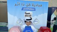 Jaber Al Muhannadi with his money-saving box. 