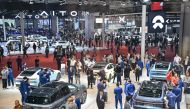 People visit a Nio booth during the 20th Shanghai International Automobile Industry Exhibition in Shanghai on April 18, 2023. (Photo by Hector Retamal / AFP)