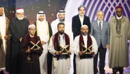 Officials with top three winners of the Katara Prize for Quran Recitation.