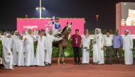 The connection of Saqr celebrate after the Khalifa bin Sheail Al Kuwari-owned gelding won the feature race, the Al Jumayliyah Cup at the Al Rayyan Racecourse yesterday. Pic: Juhaim/QREC
