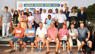 The podium winners of the Qatar Senior Open, pose for a photograph with officials. 