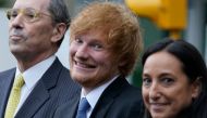 British singer-songwriter Ed Sheeran (centre) departs Manhattan Federal Court in New York, on May 4, 2023. (Photo by TIMOTHY A. CLARY / AFP)

