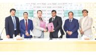 Yasir Nainar, Vice President of MIE-SPPU and Shaijan M O, Regional Director of Lulu Hypermarket, Qatar Region exchanging documents after signing the agreement.