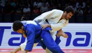 Georgia’s Luka Maisuradze and Lasha Bekauri (white) compete in the men’s -90kg final bout. Picture: AFP