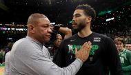 L-R) Head Coach Doc Rivers of the Philadelphia 76ers congratulates Jayson Tatum #0 of the Boston Celtics after game seven of the 2023 NBA Playoffs Eastern Conference Semifinals at TD Garden on May 14, 2023 in Boston, Massachusetts. (Photo by Adam Glanzman / GETTY IMAGES NORTH AMERICA / Getty Images via AFP)
