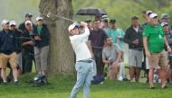 Scottie Scheffler of the United States plays a second shot on the 18th hole during the second round of the 2023 PGA Championship at Oak Hill Country Club on May 19, 2023 in Rochester, New York. (Photo by Warren Little / GETTY IMAGES NORTH AMERICA / Getty Images via AFP)
