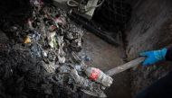 This photograph shows waste trapped by a net from a rainwater outlet channel, in Rouen, north-western France, on March 28, 2023. Photo by Lou BENOIST / AFP