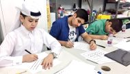 Participants during an Arabic calligraphy workshop.