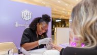 A guest having a manicure during Galeries Lafayette Doha's ‘Beauty Weekend’.