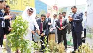 Mohammed Abdulla Mohammed, Head of the Garden Section of Doha Municipality, and Shanavas P, the Regional Manager of Lulu Hypermarkets in Qatar planting a tree at an event held at Lulu Hypermarket D Ring Road branch.