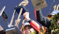 Ferrari N.51 499P Hypercar drivers Italian Alessandro Pier Guidi celebrates on the podium after winning the endurance race 24 hours of Le Mans on June 11, 2023. This year marks the 100th anniversary of the race. (Photo by Fred TANNEAU / AFP)