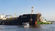 This handout photograph taken on June 11, 2023 and released by the Karachi Port Trust (KPT) shows a Russian cargo ship carrying crude oil at the port in Karachi. (Photo by Karachi Port Trust / AFP)