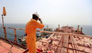 A man stands on the deck of the beleaguered Yemen-flagged FSO Safer oil tanker, in the Red Sea off the coast of Yemen's contested western province of Hodeida on June 12, 2023. (Photo by Mohammed Huwais / AFP)