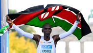 (Files) In this file photo taken on September 25, 2022 Kenya's Eliud Kipchoge crosses the finish line and wins the Berlin Marathon race in Berlin. (Photo by Tobias Schwarz / AFP)

