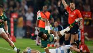 Argentina's wing Mateo Carreras (Bottom R) tackles South Africa'scenter Lukhanyo Am during the Rugby Championship final-round match between South Africa and Argentina at Ellis Park in Johannesburg on July 29, 2023. (Photo by WIKUS DE WET / AFP)
