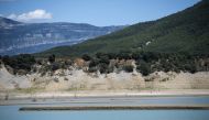 Picture shows the Mediano reservoir at 25.5% of its capacity due to the ongoing drought, on July 26, 2023 in Mediano, Huesca province. Photo by ANDER GILLENEA / AFP