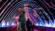 Residents enjoying their weekend at Lusail Marina Promenade's fountain on Friday, August 4, 2023. Pic: Salim Matramkot / The Peninsula 