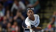 Simone Biles competes on the balance beam during the Core Hydration Classic at Now Arena on August 05, 2023 in Hoffman Estates, Illinois. Stacy Revere/Getty Images/AFP