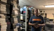 Historian, pioneering hip hop documentarian and historian Ralph McDaniels stands among his archives of footage spanning 40 years, in Elmont, New York on July 28, 2023. Photo by Maggy DONALDSON / AFP