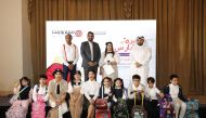 Representatives of Landmark Group Qatar, Shumalan Naicker (second left), Territory Head; Raj Gopal (left), Senior Marketing Manager; with Abdul Aziz (right), a senior official from Qatar Red Crescent, pose with child models during the preview of ‘back to school' collection’ by Centrepoint. Pics: Salim Matramkot/The Peninsula