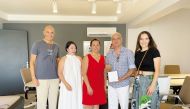 CineMoon Ensemble members present the Desert Rose to KUSAV Chairman of the Board, Levent Köylü (second right). PIC: Joelyn Baluyut/The Peninsula