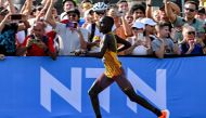 Uganda's Victor Kiplangat reacts as he comptes in the men's marathon final during the World Athletics Championships in Budapest on August 27, 2023. (Photo by Ferenc ISZA / AFP)