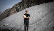 Director of Research at the French National Centre for Scientific Research (CNRS), biologist Eric Marechal, poses for a photograph holding an original edition of 1819 of Arctic Explorator John Ross book 