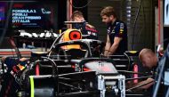 A mechanic works on the car of Red Bull Racing's Dutch driver Max Verstappen in the pits of the Monza Circuit ahead of the Italy's Formula One Grand Prix, on august 31, 2023, in Monza northern Italy. Photo by Marco BERTORELLO / AFP