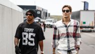 Mercedes' British drivers, Lewis Hamilton (L) and George Russell (R) arrive at the paddock of the Zandvoort Circuit ahead of the Dutch Formula One Grand Prix, in the coastal town of Zandvoort on August 24, 2023. Photo by Simon Wohlfahrt / AFP