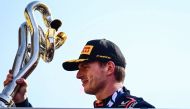 First placed Red Bull Racing's Dutch driver Max Verstappen celebrates with his trophy on the podium after the Italian Formula One Grand Prix race at Autodromo Nazionale Monza circuit, in Monza on September 3, 2023. (Photo by Ben Stansall / AFP)