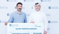 Doha Bank Chief Retail Banking Officer, Braik Almarri with first prize winner of the salary transfer campaign, Ajayan Cheruvillil Bahuleyan.