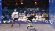 Qatar's Abdulla Mohamed Al Tamimi (left) in action against Frenchman Lucas Serme during their QTerminals Qatar Classic first round match, yesterday.
