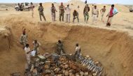 A joint Saudi-backed Sudanese-Yemeni military experts force removes and deactivates some 5,000 landmines on January 30, 2021, which they said were planted by the Iran-aligned Huthi rebels in Yemen's northern coastal town of Midi, located in conflict-ridden Hajjah governorate near the border with Saudi Arabia on the Red Sea. (Photo by AFP)

