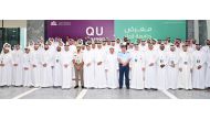 Qatar University President Dr. Omar Al Ansari poses with other officials and students during the opening day of QU Career Fair yesterday.