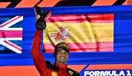 Ferrari's Spanish driver Carlos Sainz Jr celebrates on the podium after winning the Singapore Formula One Grand Prix night race at the Marina Bay Street Circuit in Singapore on September 17, 2023. (Photo by Lillian Suwanrumpha / AFP)