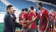 Qatar Olympic Committee Secretary General and Qatar Football Association President Jassim Rashid Al Buenain meets Qatar U23 football squad in Hangzhou yesterday.    