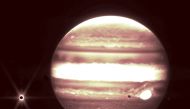 This handout image released by NASA on September 21, 2023, shows the planet Jupiter (right) and it's moon Europa (left) as seen through The James Webb Space Telescope NIRCam instrument 2.12 micron filter.  (Photo by B. Holler and J. Stansberry / ESA, NASA, CSA, STScI / AFP) 