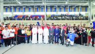 UDST officials with students after the International University Sport Week.