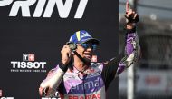 First-placed Prima Pramac Racing Spanish rider Jorge Martin celebrates on the podium following the sprint race of the Indonesian Grand Prix MotoGP on October 14, 2023. (Photo by Sonny Tumbelaka / AFP)