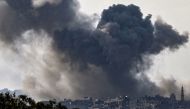 Smoke plumes rising above buildings during an Israeli strike on the Gaza Strip yesterday.