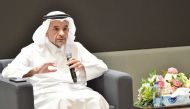 QU President Dr. Omar Al Ansari speaking during an event.