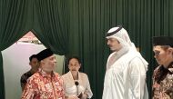 National Museum of Qatar Director, Sheikh Abdulaziz Al Thani (right); Ambassador of Indonesia to Qatar, H E Ridwan Hassan (left); and other officials during the opening of the exhibition.