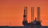 Oil rig is seen at sunset in Rotterdam, Netherlands.