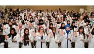 Class of 2028 QU Medicine students take their oath as part of the annual white coat ceremony.