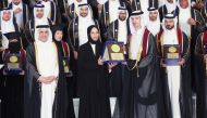 Minister of Education and Higher Education H E Buthaina bint Ali Al Jabr Al Nuaimi honouring a graduate. CCQ President Dr. Khalid Mohamed Al Horr (left) is also seen. 