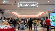 People look at merchandise on display at a Nintendo store in central Tokyo on November 6, 2023. Photo by Richard A. Brooks / AFP