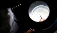 A lab technician studies mosquitoes carrying the Chikungunya virus in a public health laboratory in Acapulco, Guerrero State, Mexico, on April 15, 2015. Photo by Pedro PARDO / AFP