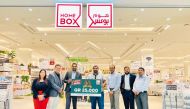 Shumalan Naicker, Territory Head Landmark Group Qatar, and Rajagopal, Senior Marketing Manager Landmark Group Qatar, with Home Box team and winners.