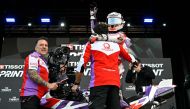 Ducati Spanish rider Jorge Martin celebrates winnig the sprint race of the MotoGP Valencia Grand Prix at the Ricardo Tormo racetrack in Cheste, on November 25, 2023. (Photo by JAVIER SORIANO / AFP)
